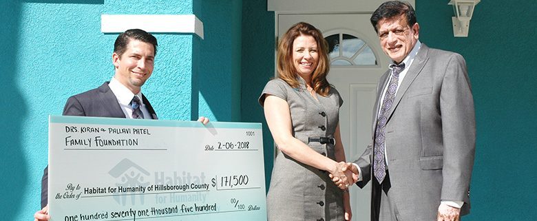 Patel Family Foundation presents $171,500 check to build 2 Habitat homes