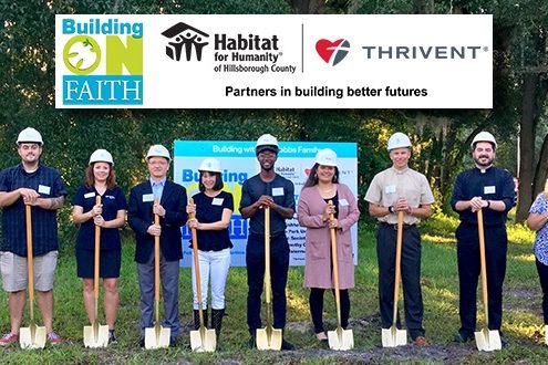 Raising the roof on the first of two Habitat-Thrivent Faith Build homes